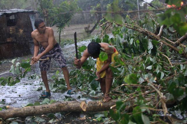 Villagers clear fallen trees caused by Typhoon Man-yi in San Jose city Nueva Ecija province Philippines 17 Nov 2024 EPA-Yonhap