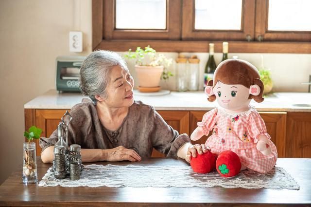 This undated photo shows caregiver robot Hyodol conversing with an elderly woman Courtesy of Hyodol