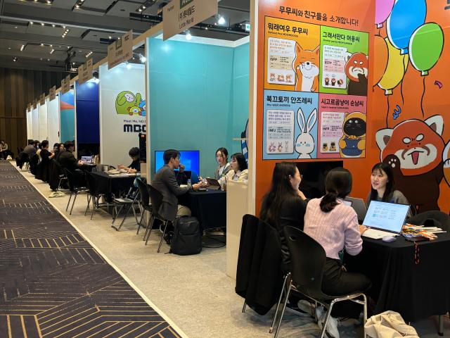 Buyers receive consultations at booths during Content IP Market at COEX in Seoul Nov 19 2024 AJP Han Jun-gu