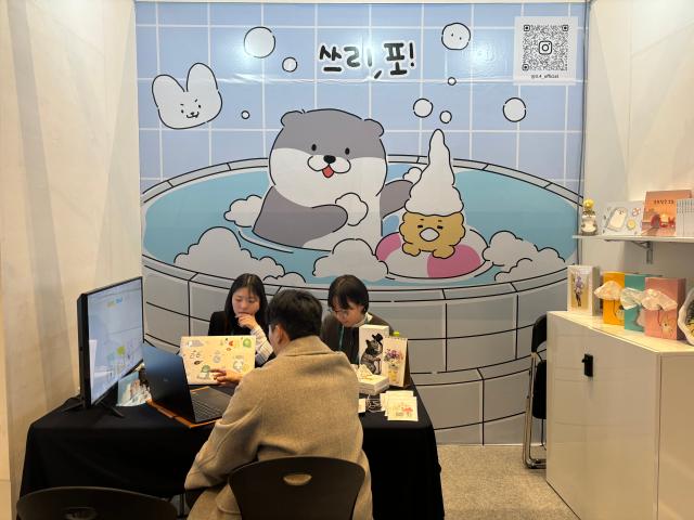 A buyers receives consultations at booths during Content IP Market at COEX in Seoul Nov 19 2024 AJP Han Jun-gu