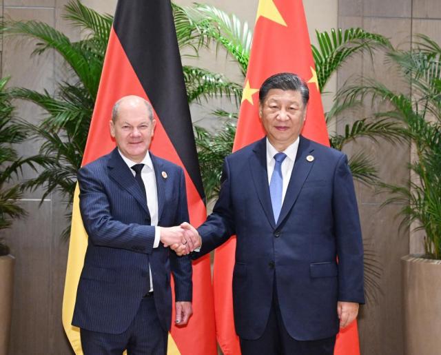 Chinese President Xi Jinping shakes hands with German Chancellor Olaf Scholz on the sidelines of the G20 Leaders Summit in Rio de Janeiro Brazil Nov 19 2024 Xinhua-Yonhap