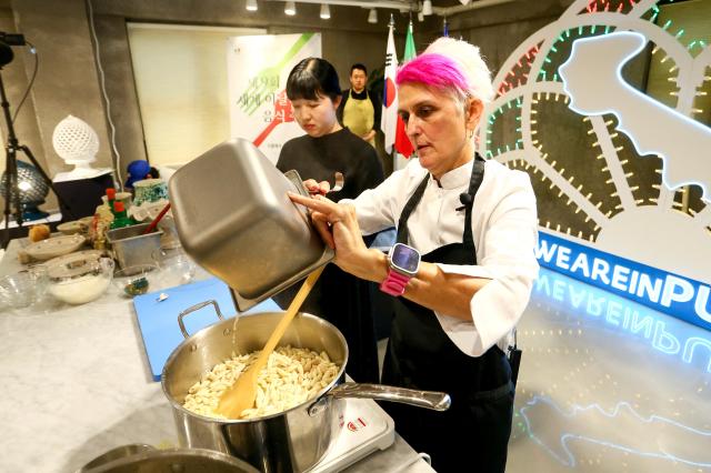 Michelin-starred chef Cristina Bowerman prepares Mediterranean dishes during the Week of Italian Cuisine event in Seoul on Nov 20 2024 AJP Kim Dong-woo