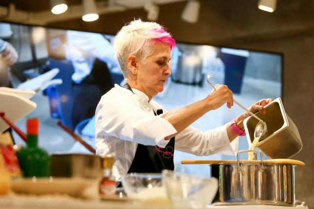 Michelin-starred chef Cristina Bowerman prepares Mediterranean dishes during the Week of Italian Cuisine event in Seoul on Nov 20 2024 AJP Kim Dong-woo