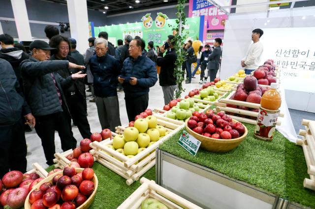 Visitors browse fruit displays at the Korea Fruit Industry Exhibition 2024 at aT Center in Seoul on Nov 21 2024 AJP Kim Dong-woo