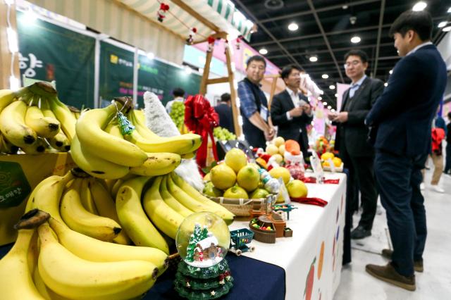 Visitors browse fruit displays at the Korea Fruit Industry Exhibition 2024 at aT Center in Seoul on Nov 21 2024 AJP Kim Dong-woo