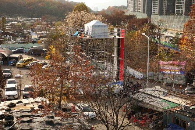 Residents demand residency certificates and land purchase rights for redevelopment from the Seoul Metropolitan Government at the entrance of Guryong Village Seoul Nov 25 2024 AJP Han Jun-gu