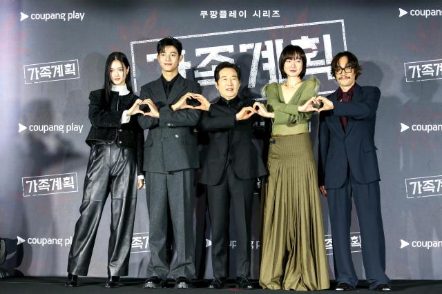 Actress Lee Su-hyun from left Lomon Baek Yoon-sik Bae Doona and Ryoo Seung-bum pose for photographs during a press conference for the series Family Matters in Seoul on Nov 26 2024 AJP Kim Dong-woo