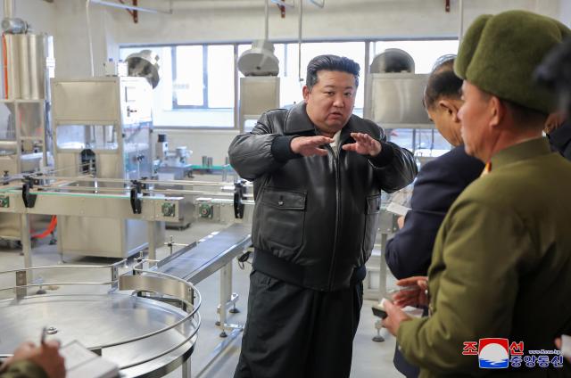 North Korean leader Kim Jong-un talks to officials during a visit to an industrial complex in Songchon Country in South Pyongan Province Nov 19 2024 Yonhap