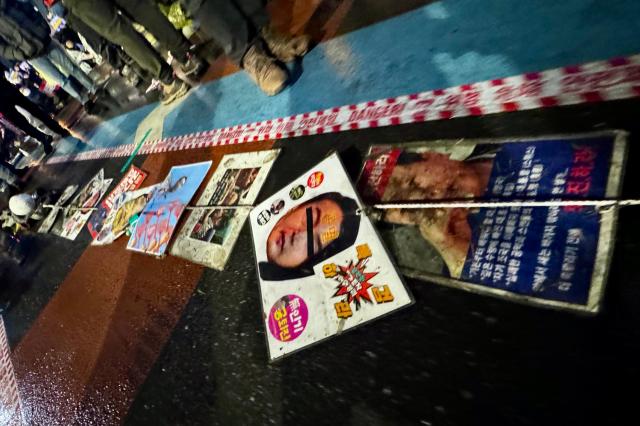 Citizens march with signs during a protest against presidential vetoes in central Seoul on Nov 30 2024 AJP Kim Dong-woo