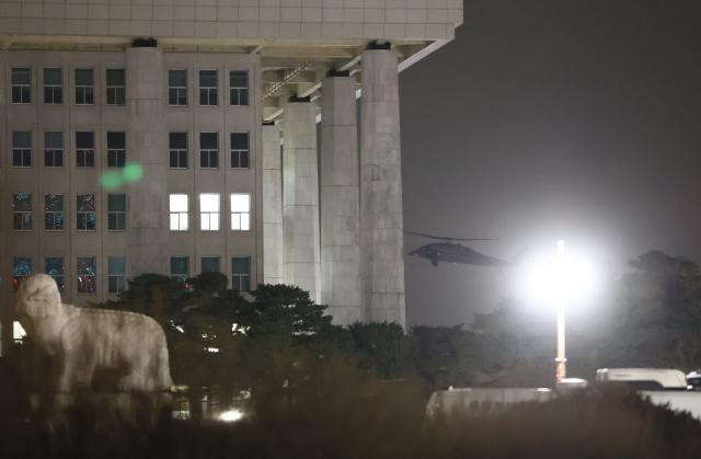 Helicopters over National Assembly building in Seoul Dec 3 after President Yoon declares martial law Yonhap