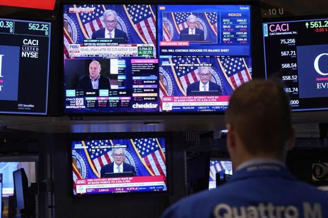 Comments by Federal Reserve Chair Jerome Powell appear on a bank of screens on the floor of the New York Stock Exchange in New York on Nov 7 2024  AP-Yonhap