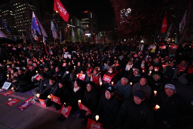 Citizens gather to demand the resignation and arrest of President Yoon Suk Yeol near Gwanghwamun Station in Seoul on Dec 4 2024 AJP Han Jun-gu