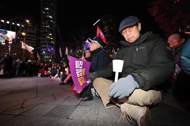 Citizens gather to demand the resignation and arrest of President Yoon Suk Yeol near Gwanghwamun Station in Seoul on Dec 4 2024 AJP Han Jun-gu