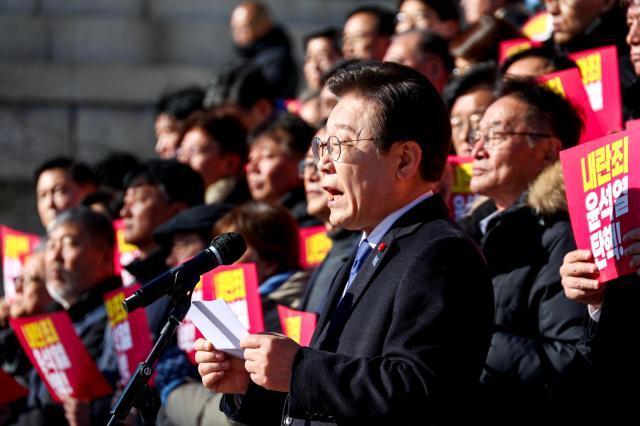 The main opposition Democratic Party leader Lee Jae-myung speaks during a press conference at the National Assembly in Seoul on Dec 6 2024 AJP Kim Dong-woo