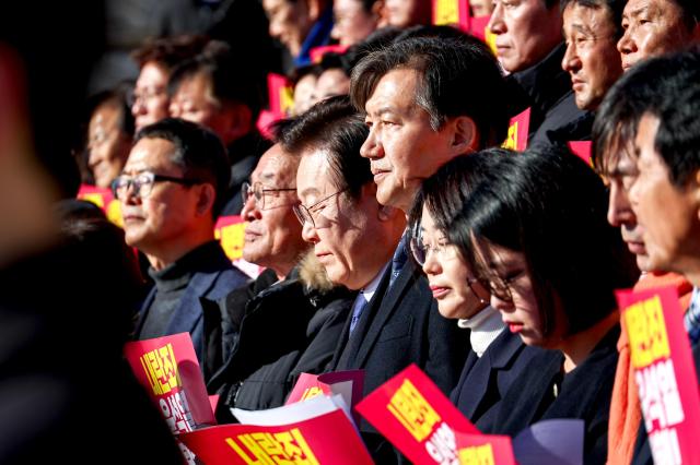 Opposition party representatives hold a joint press conference in front of the National Assembly in Seoul on Dec 6 2024 AJP Kim Dong-woo