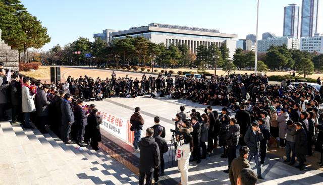 Opposition party representatives hold a joint press conference in front of the National Assembly in Seoul on Dec 6 2024 AJP Kim Dong-woo