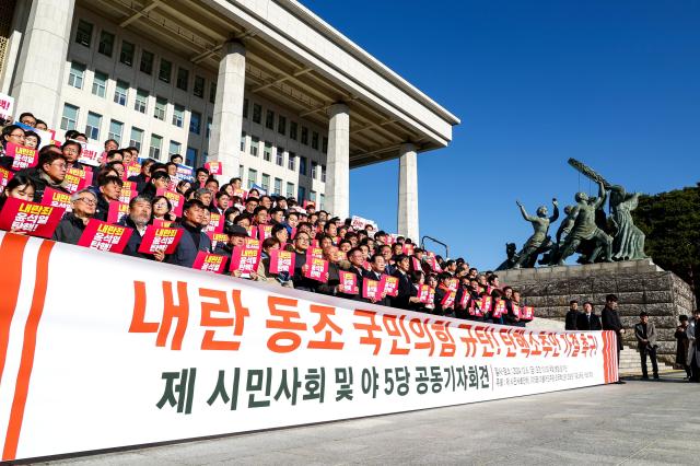 Opposition party representatives hold a joint press conference in front of the National Assembly in Seoul on Dec 6 2024 AJP Kim Dong-woo