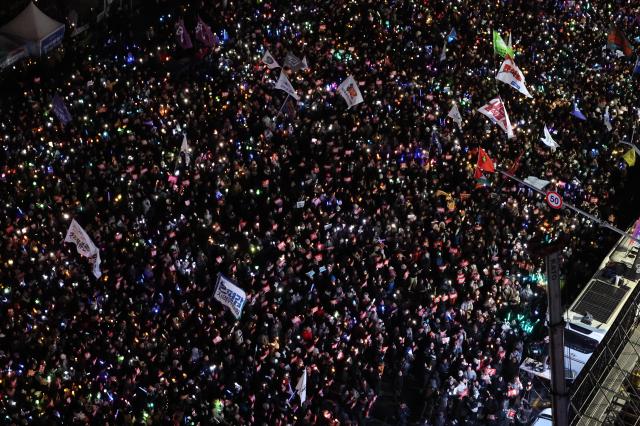 Citizens participate in a protest in front of the National Assembly building in Yeouido on Dec 7 As of 430 pm police estimated the crowd at 45000 AJP Han Jun-gu