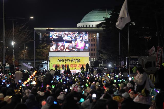 Seoul citizens protest against South Korean President Yoon Suk Yeol in front of the National Assembly in Seoul Korea on Dec 8 2024 Yonhap