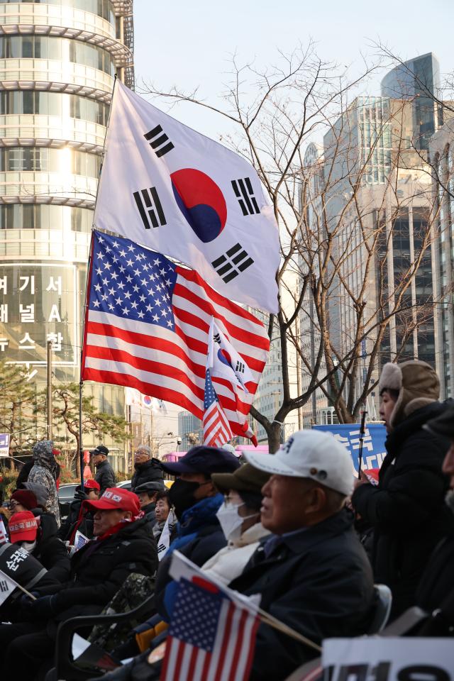 People gather to protest against the impeachment of President Yoon Suk Yeol and calling for the arrest of Lee Jae-myung leader of the main opposition Democratic Party DP near Gwanghwamun Station on Dec 11 2024 AJP Han Jun-gu