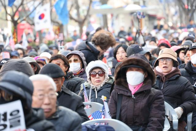 People gather to protest against the impeachment of President Yoon Suk Yeol and calling for the arrest of Lee Jae-myung leader of the main opposition Democratic Party DP near Gwanghwamun Station on Dec 11 2024 AJP Han Jun-gu