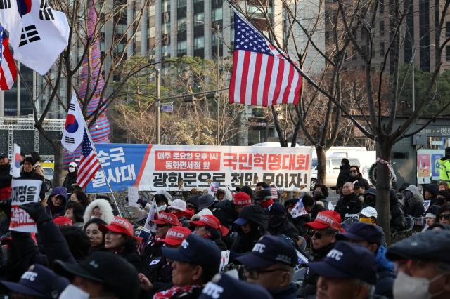 People gather to protest against the impeachment of President Yoon Suk Yeol and calling for the arrest of Lee Jae-myung leader of the main opposition Democratic Party DP near Gwanghwamun Station on Dec 11 2024 AJP Han Jun-gu