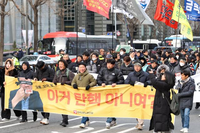 Members of the Korean Confederation of Trade Unions march from City Hall Station to the Presidential Office in Yongsan in Seoul Dec 12 2024 AJP Han Jun-gu