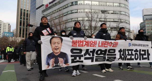 Members of the Korean Confederation of Trade Unions march from City Hall Station to the Presidential Office in Yongsan in Seoul Dec 12 2024 AJP Han Jun-gu