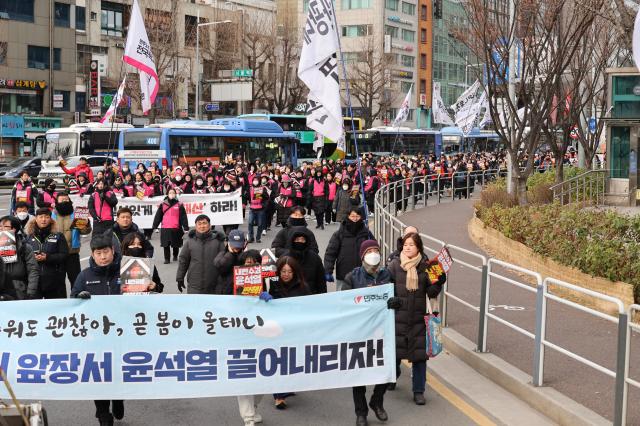 Members of the Korean Confederation of Trade Unions march from City Hall Station to the Presidential Office in Yongsan in Seoul Dec 12 2024 AJP Han Jun-gu