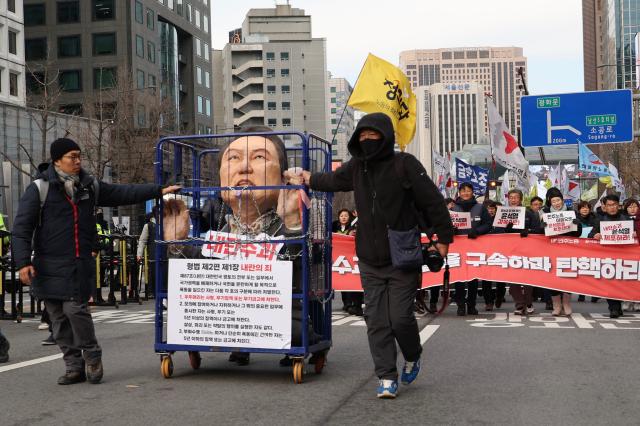 Members of the Korean Confederation of Trade Unions hold a ceremonial protest calling for the impeachment of President Yoon Suk Yeol near City Hall Station in Seoul Dec 12 2024 AJP Han Jun-gu