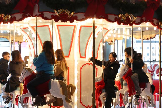 Visitors ride a carousel at COEX in Seoul Dec 13 2024 AJP Han Jun-gu