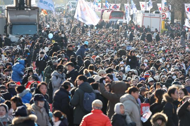 People gather near the National Assembly in Yeouido Seoul calling for President Yoon Suk Yeols impeachment on Dec 14 2024 AJP Han Jun-gu