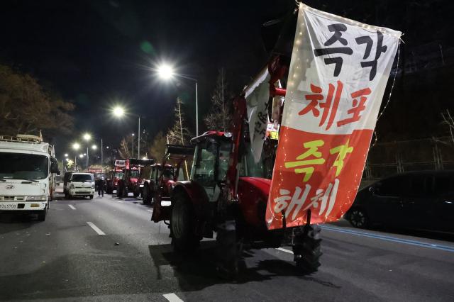 Blocked tractors and cargo trucks remain parked near Namtaeryeong Hill in Seoul Dec 22 2024 AJP Han Jun-gu