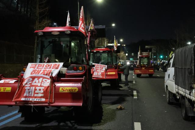 Blocked tractors and cargo trucks remain parked near Namtaeryeong Hill in Seoul Dec 22 2024 AJP Han Jun-gu