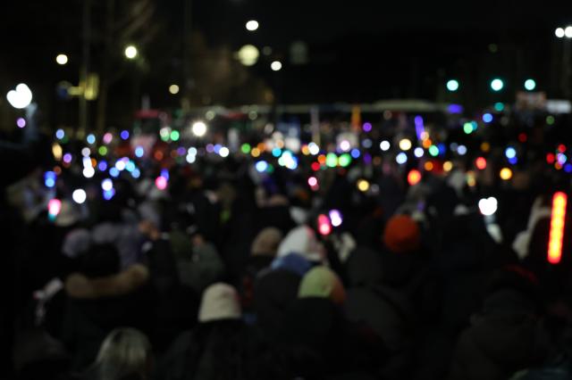 Farmers and protesters hold light sticks of various colors near Namtaeryeong Hill in Seoul Dec 22 2024 AJP Han Jun-gu