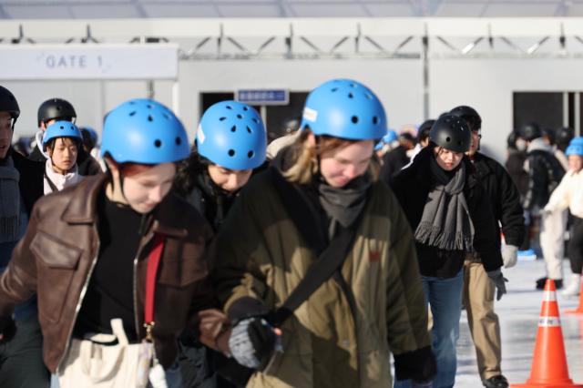 Visitors enjoy ice skating at Seoul Plaza in Seoul Dec 23 2024 AJP Han Jun-gu