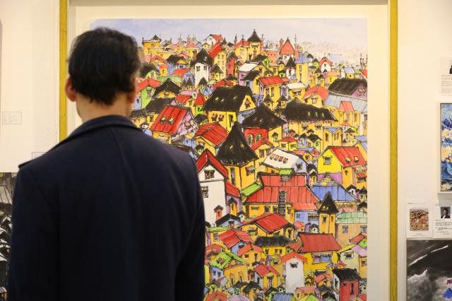 A visitor views artworks at the Art Show at COEX in Seoul Dec 26 2024 AJP Han Jun-gu