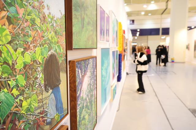 A visitor views artworks at the Art Show at COEX in Seoul Dec 26 2024 AJP Han Jun-gu