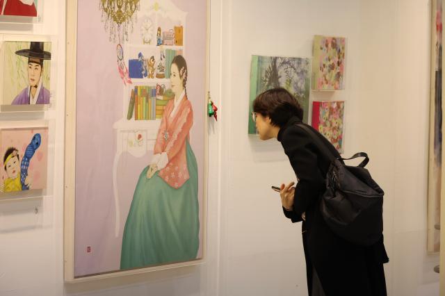 A visitor views artworks at the Art Show at COEX in Seoul Dec 26 2024 AJP Han Jun-gu