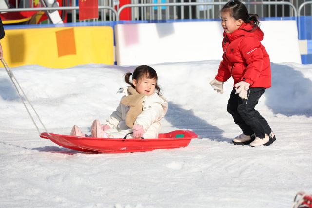 Visitors enjoy sledding at a snow park in Dongdaemun District Seoul Dec 26 2024 AJP Han Jun-gu