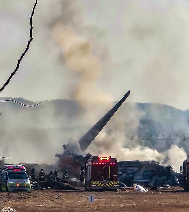 Smoke rises from a passenger aircraft that crashed while attempting to land at Muan International Airport on Dec 29 2024 Yonhap