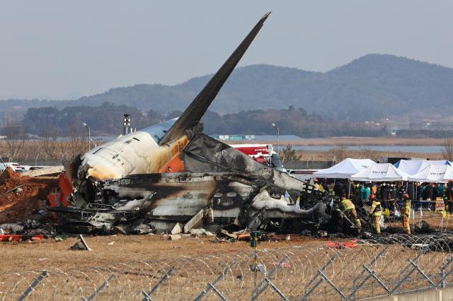 Firefighters conduct rescue operations from a passenger aircraft that crashed at Muan International Airport on Dec 29 2024 Yonhap