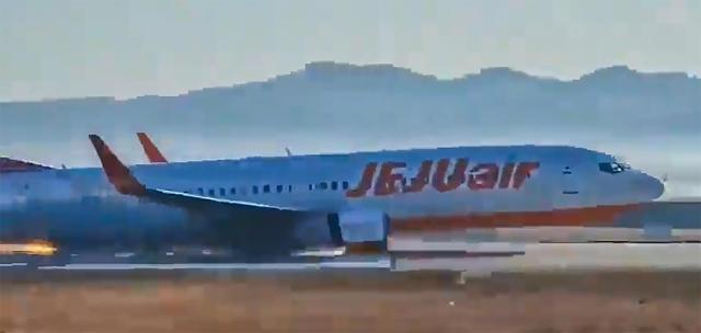 A Jeju Air flight makes a belly landing at Muan International Airport on Dec 29 2024 before it skids off the runway and crashes into a perimeter wall Yonhap