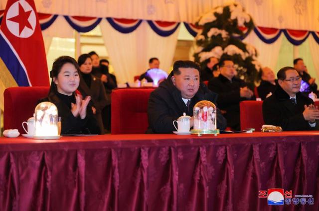 North Korean leader Kim Jong-un center accompanied by his daughter Ju-ae far  left attends an event in Pyongyang on New Years Eve in this photo released by the Norths official state-run Korean Central News Agency the following day