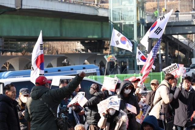 A protester throws a hand warmer at a rally near the Presidential residence in Hannam-dong Seoul on Jan 2 2025 AJP Han Jun-gu