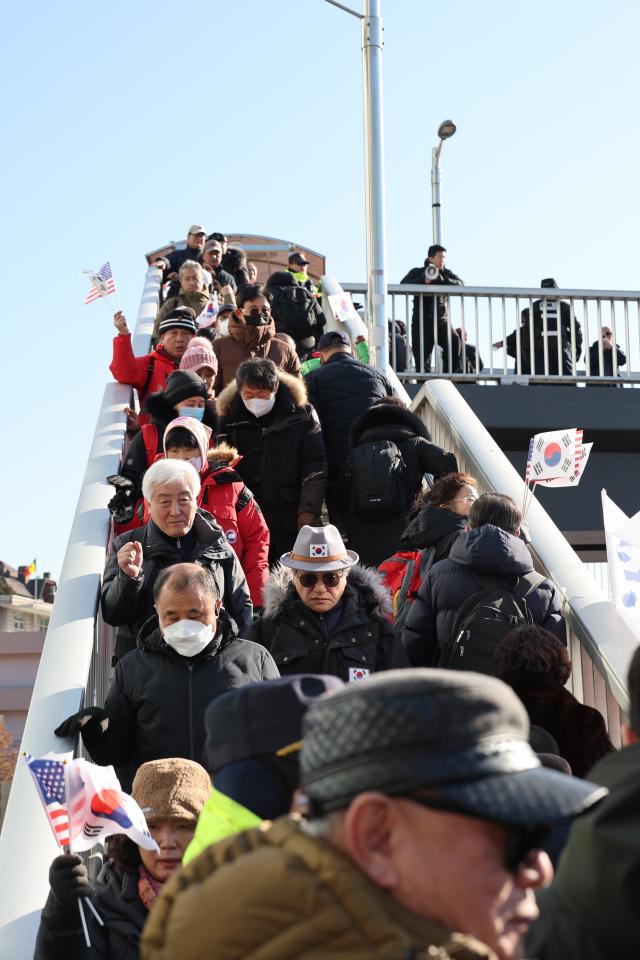 People arrive at a rally near the Presidential residence in Hannam-dong Seoul on Jan 2 2025 AJP Han Jun-gu