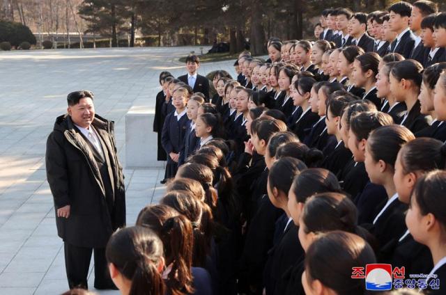 North Korean leader Kim Jong-un center meets with young meritorious individuals in Pyongyang on Jan 2 2025 in this photo released by the official state-run Korean Central News Agency the following day