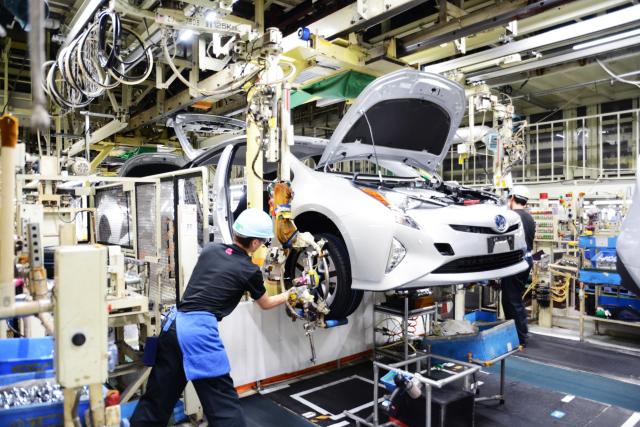 Workers assemble Toyota Motor Corps Prius model at Tsutsumi Plant located in Toyota City Courtesy of Toyota Motor Corp