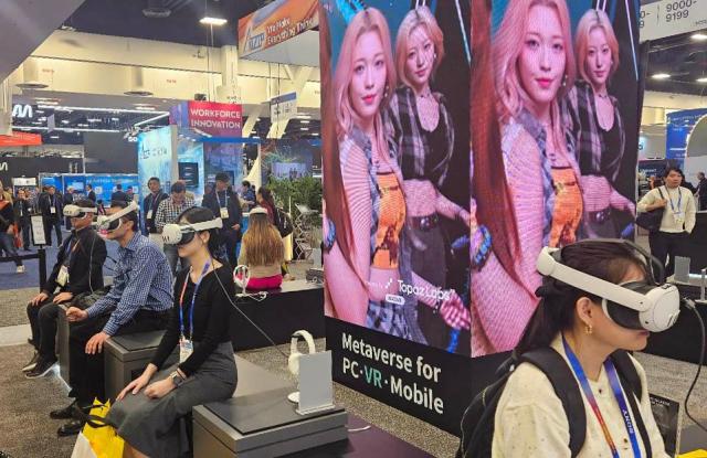 Visitors wear XR devices to watch virtual K-pop idol performances at Lotte Innovates exhibition booth at the Las Vegas Convention Center during CES 2025 Jan 8 2025 Yonhap