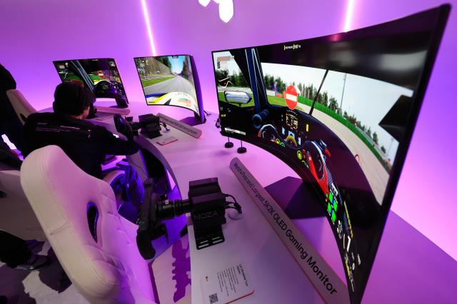 Visitors experience LG Electronics gaming OLED display at CES 2025 in Las Vegas Yonhap